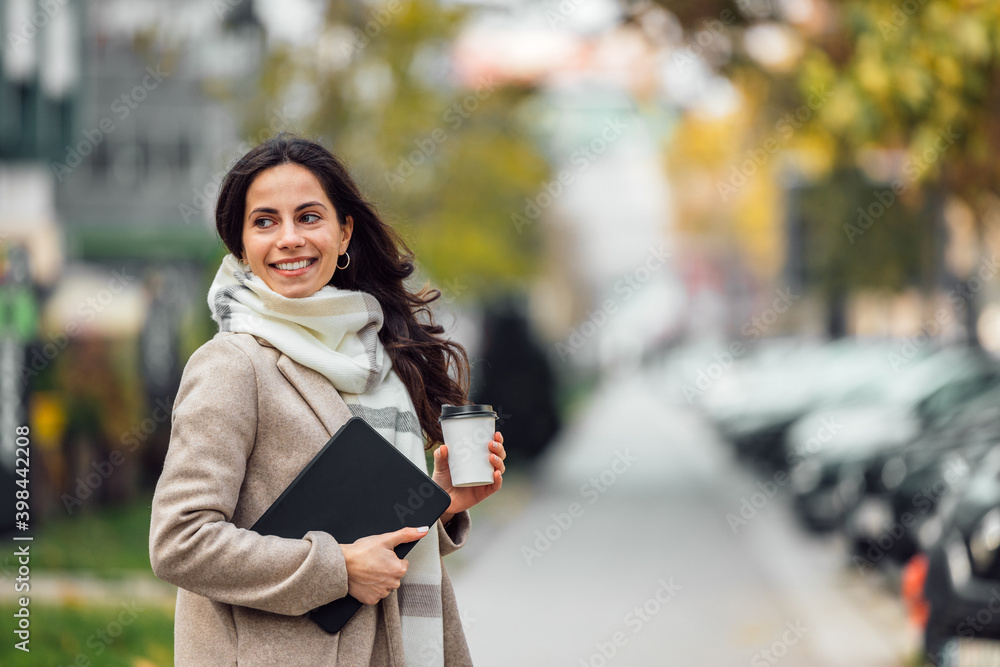 Smiling face, wearing scarf and coat, autumn season.