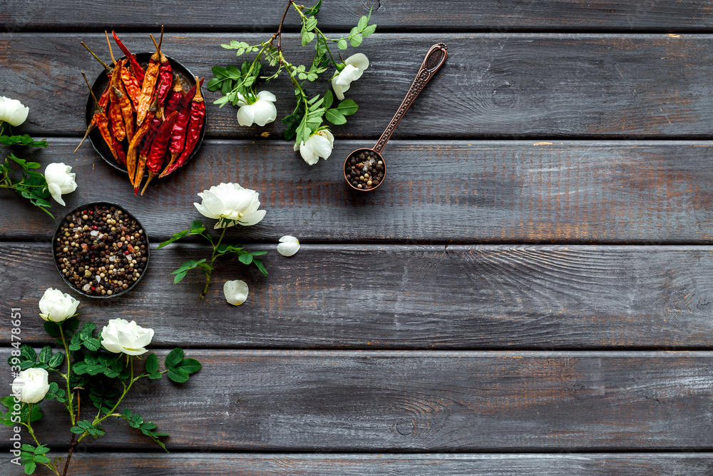 Set of hot Indian spices with flowers, top view