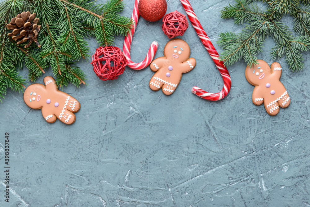 Christmas composition with gingerbread cookies on color background