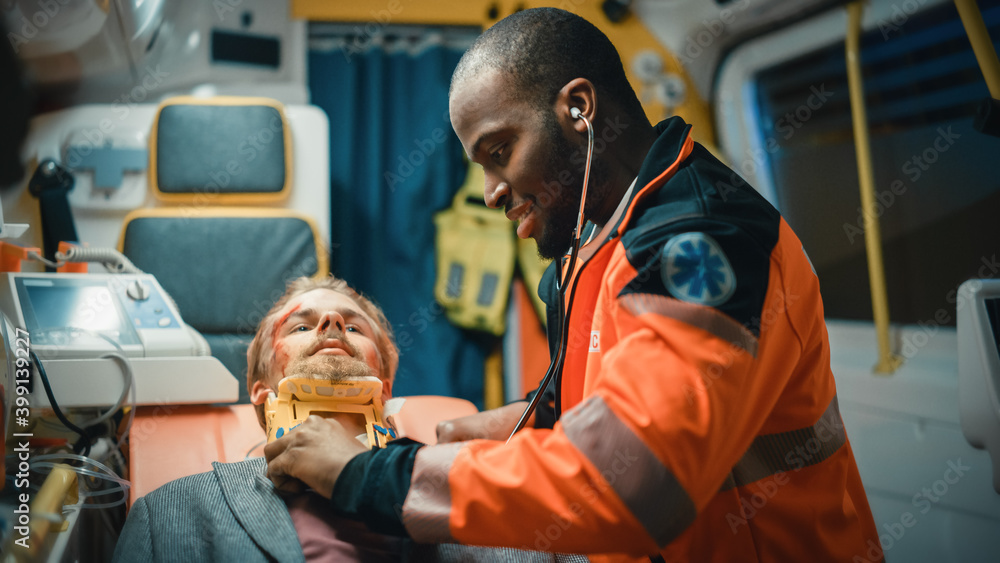 Black African American Paramedic Ride to Healthcare Hospital with Injured Patient on the Ambulance. 