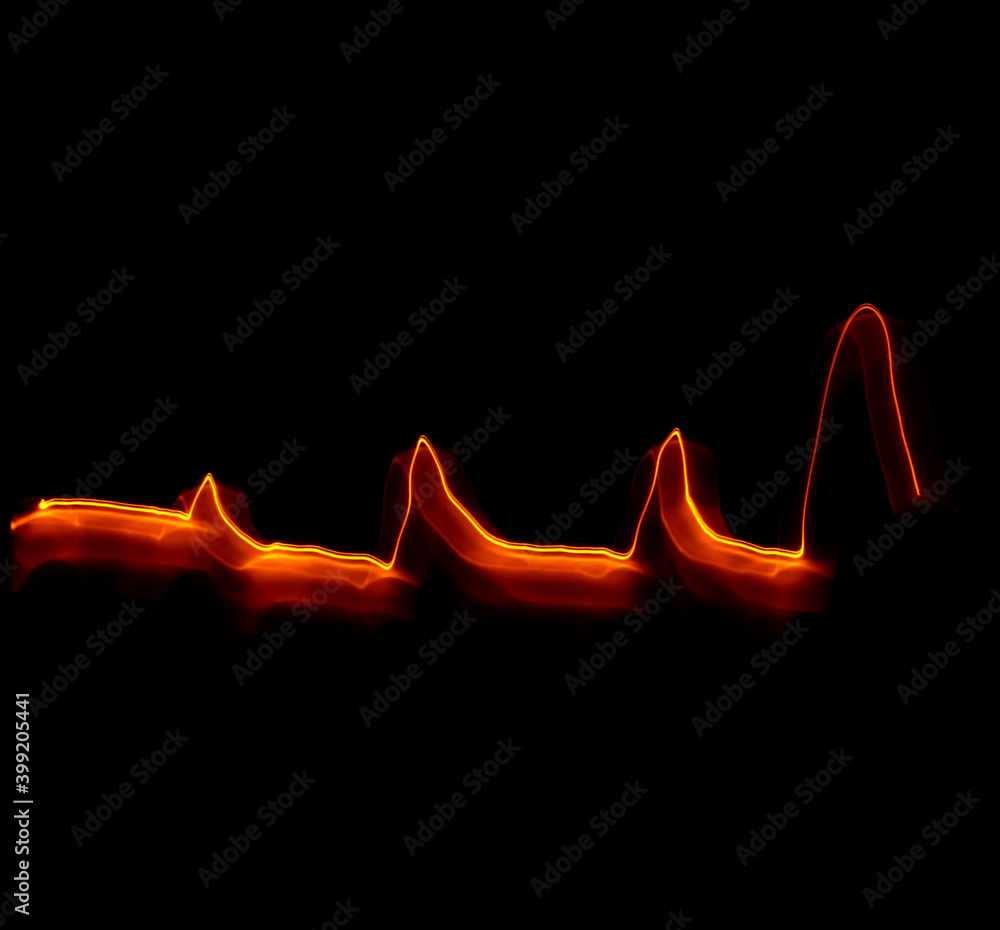 Light wave trail path, vibrant neon gold color in abstract swirls on a black background