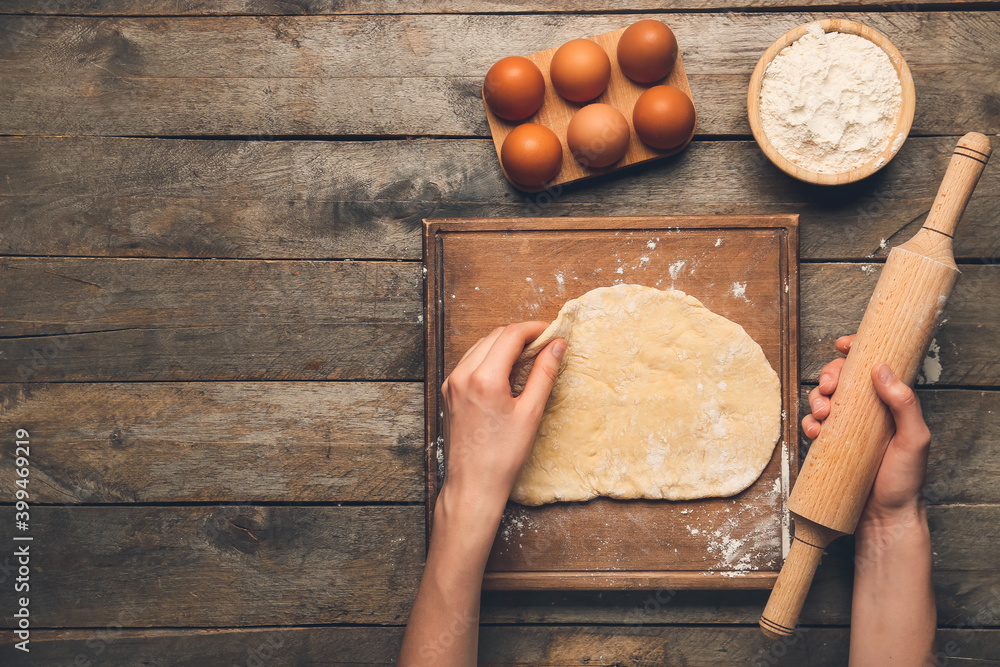 Woman preparing bakery on table, top view