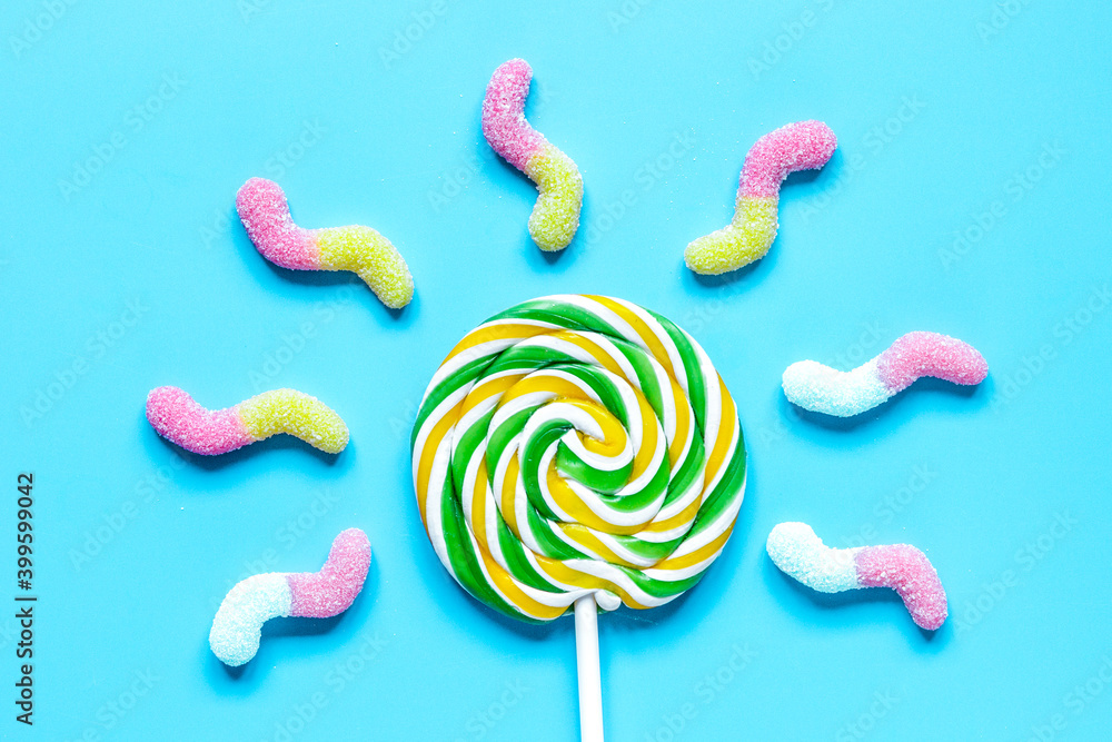 lollipop design with sugar candys on blue background top view mockup