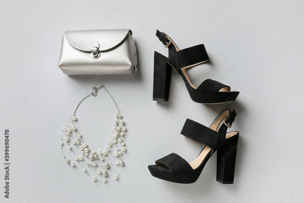 Female shoes and accessories on white background