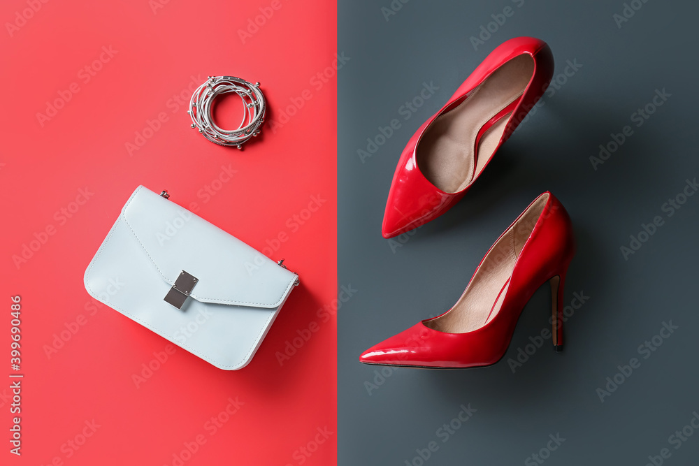 Female shoes and accessories on color background