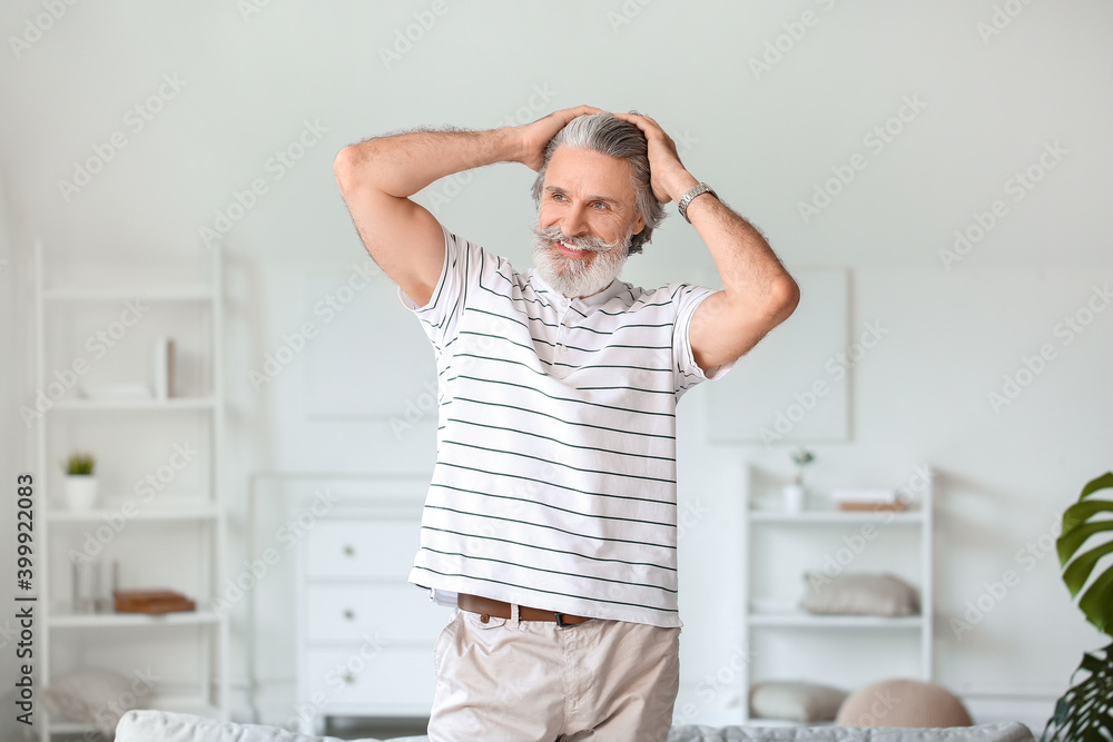 Portrait of mature man resting at home