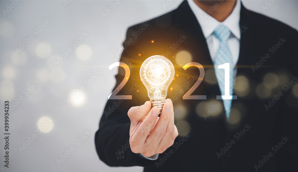 New Target business and 2021 light bulb concept, Business holding light bulb, innovative idea of ​​i