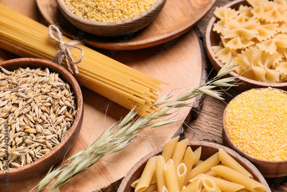 Assortment of cereals on wooden background