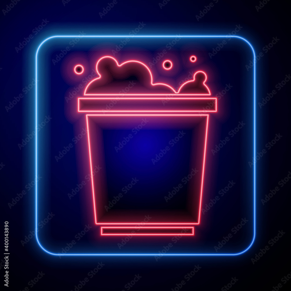 Glowing neon Bucket with foam and bubbles icon isolated on blue background. Cleaning service concept