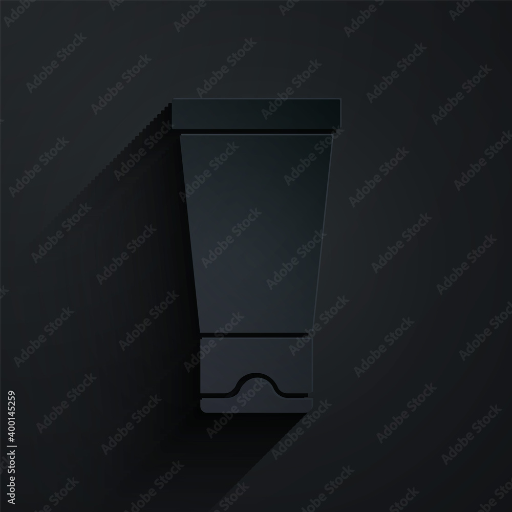 Paper cut Cream or lotion cosmetic tube icon isolated on black background. Body care products for wo