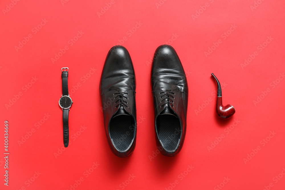 Classic leather male shoes on color background