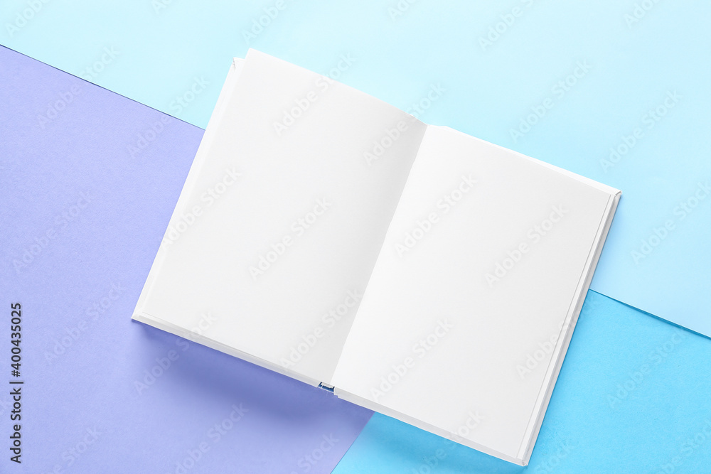 Blank book on color background