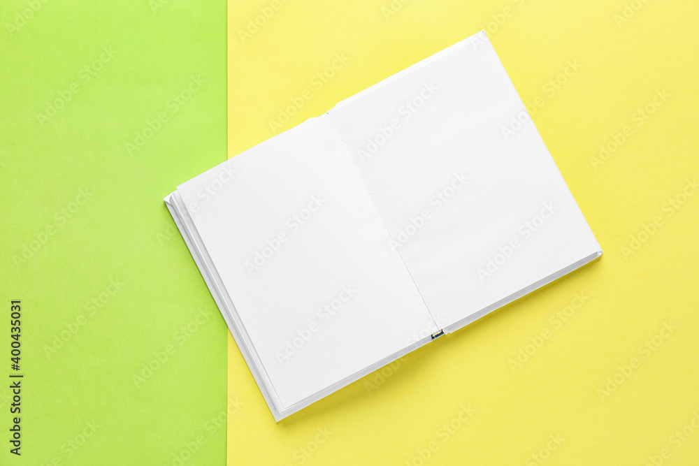 Blank book on color background