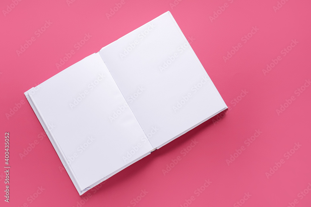 Blank book on color background