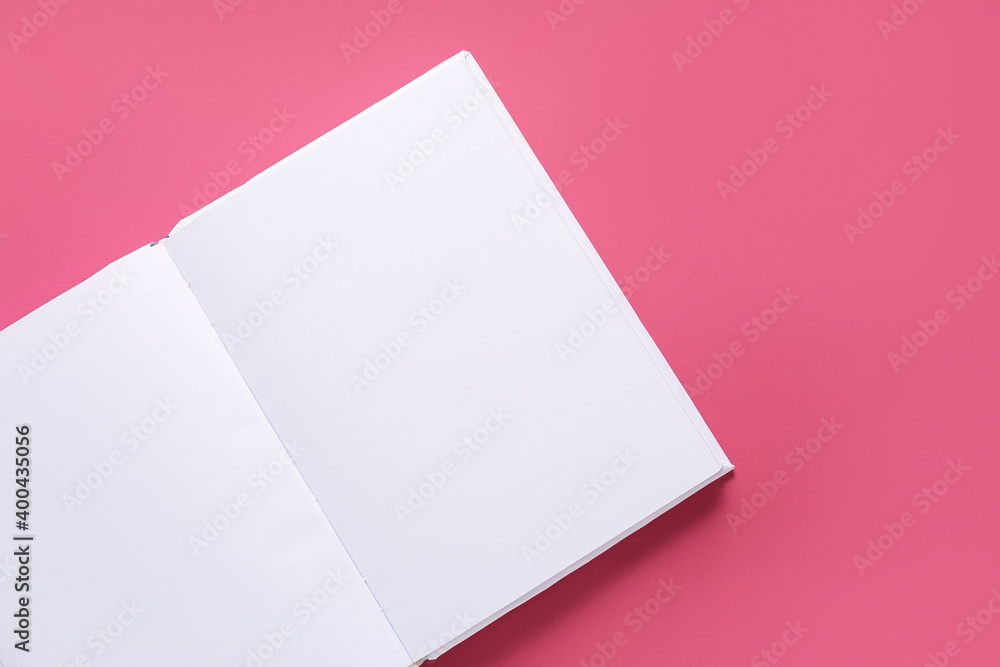 Blank book on color background