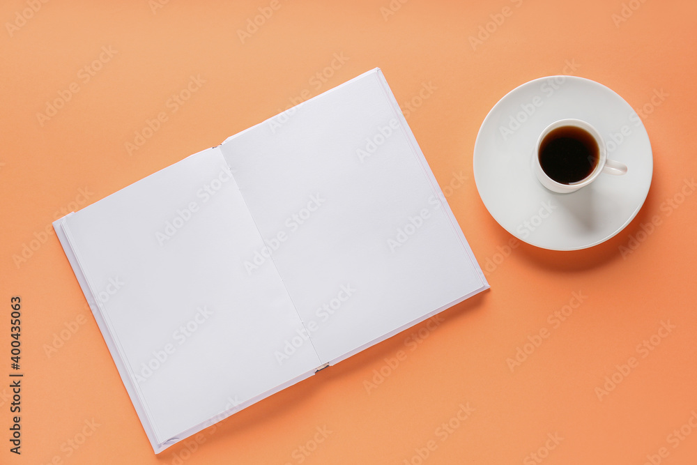 Composition with blank book and cup of coffee on color background