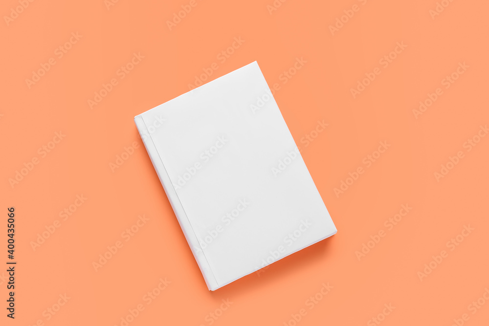 Blank book on color background