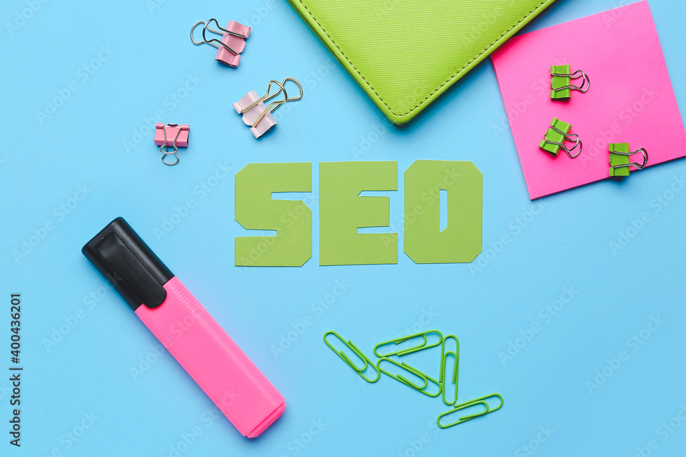 Abbreviation SEO with stationery on color background