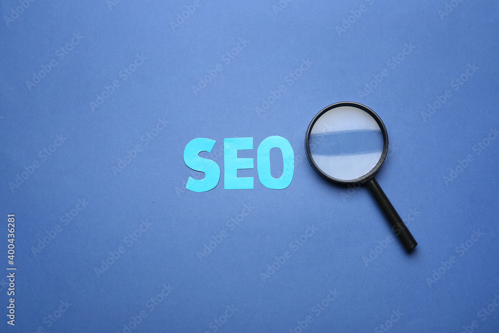 Abbreviation SEO with magnifier on color background