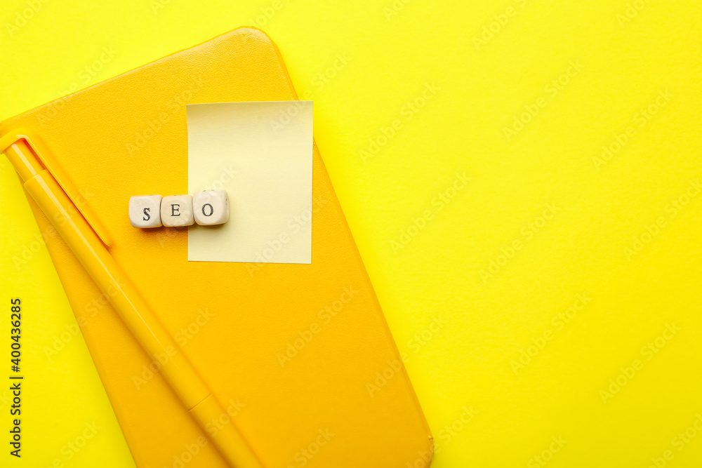 Abbreviation SEO with stationery on color background