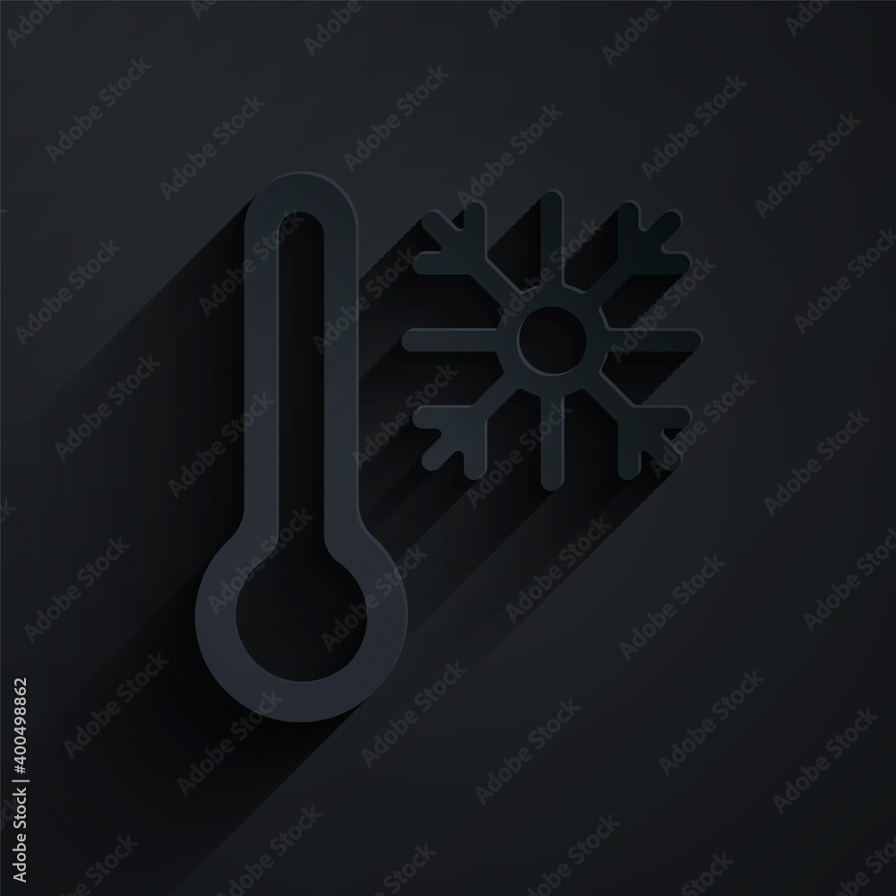 Paper cut Thermometer with snowflake icon isolated on black background. Paper art style. Vector.