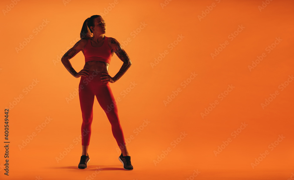 Monochrome portrait of a fit woman exercising