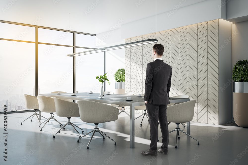 Businessman standing in conference interior