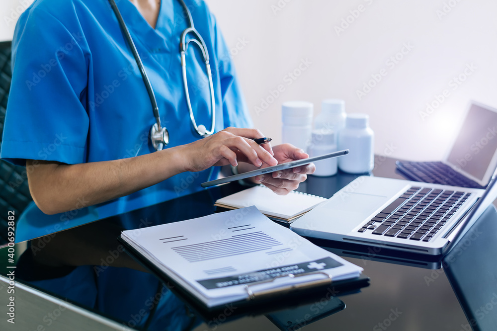 Medicine doctor hand working with modern digital tablet computer interface as medical network concep