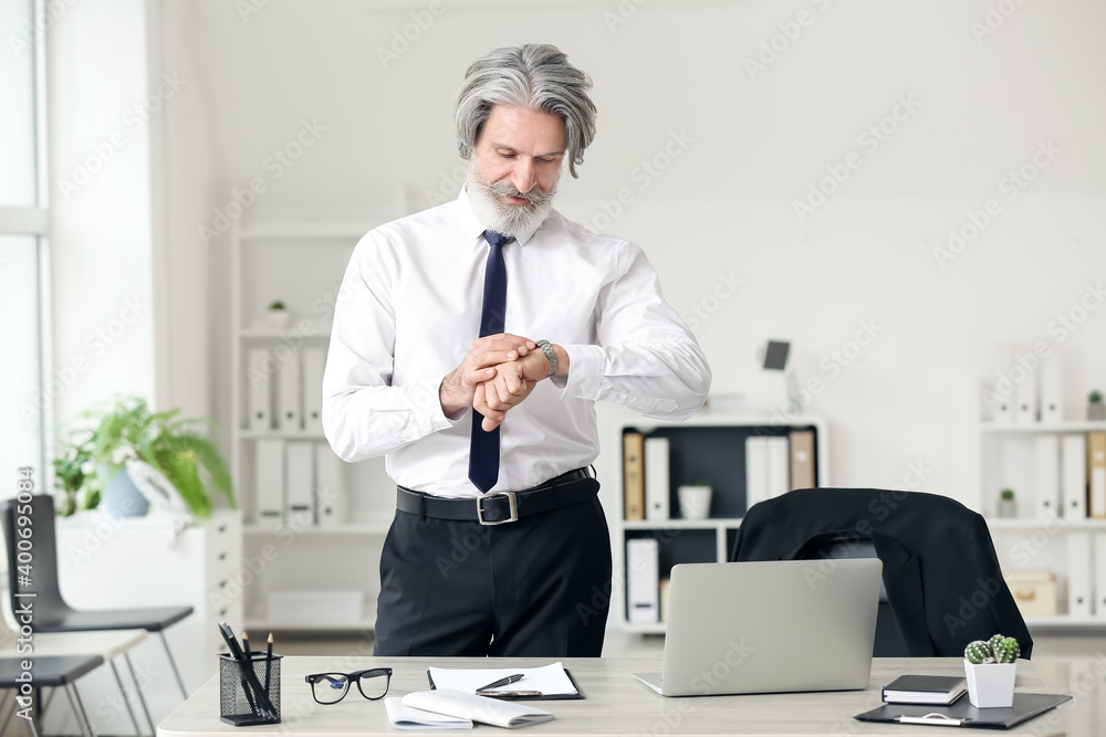 Senior businessman working in office