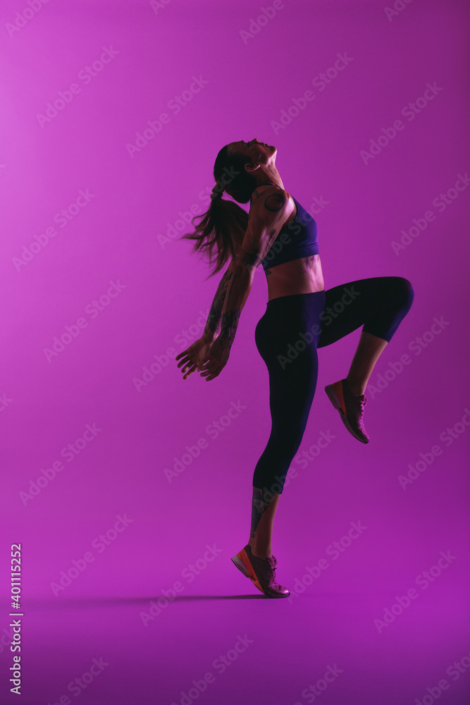 Side view portrait of a fit woman doing workout