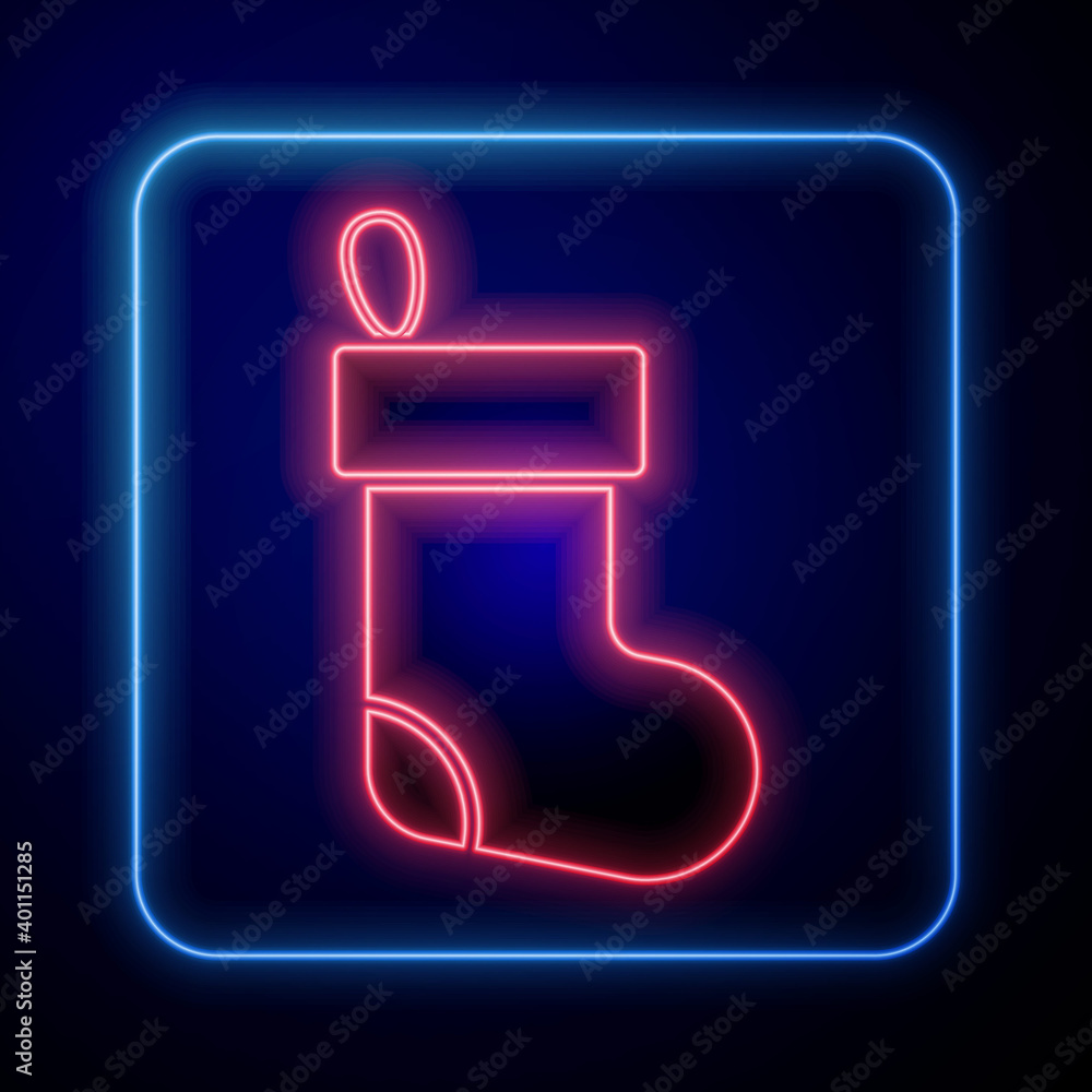 Glowing neon Christmas stocking icon isolated on blue background. Merry Christmas and Happy New Year