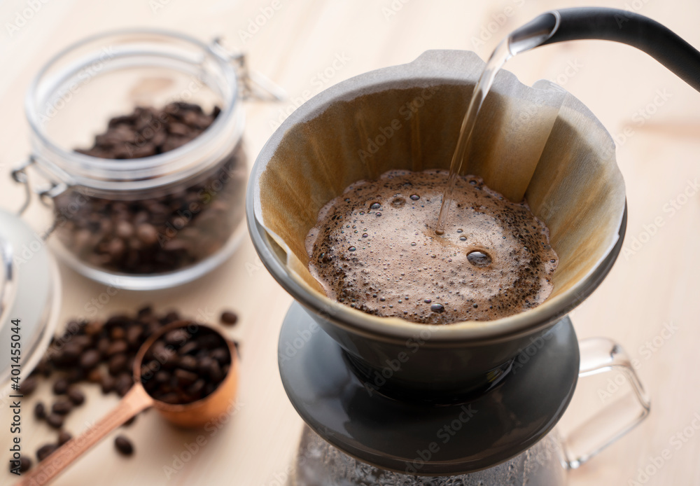 Pour hot water over the coffee powder