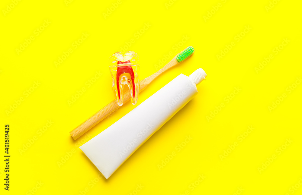 Toothbrush and paste on color background