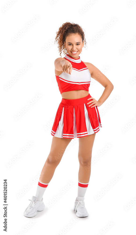 Beautiful young cheerleader on white background