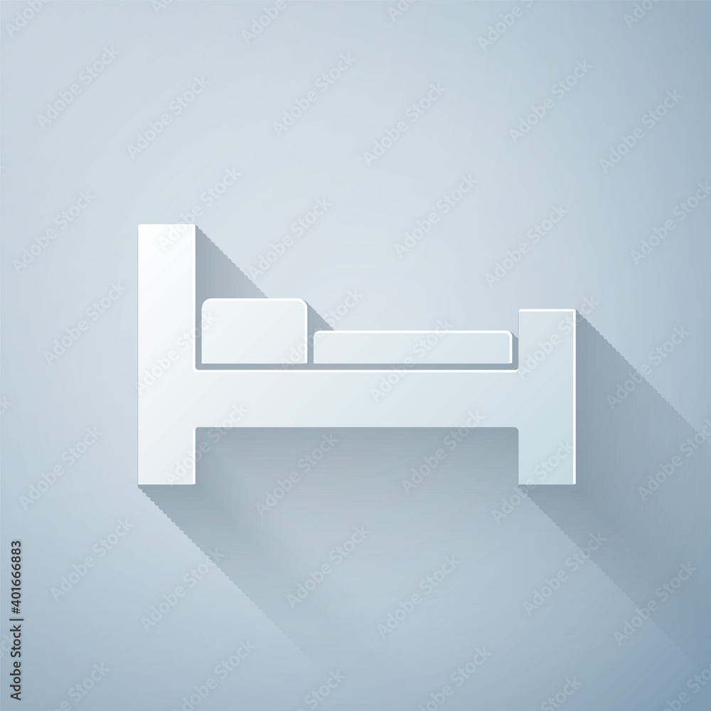 Paper cut Hotel room bed icon isolated on grey background. Paper art style. Vector.