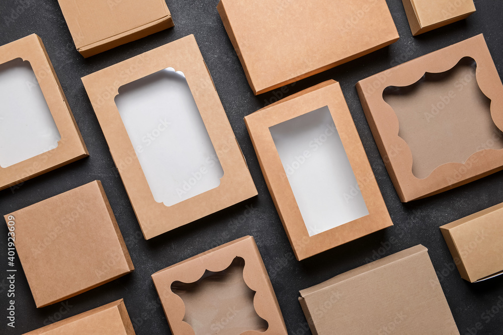 Set of blank cardboard boxes on dark background