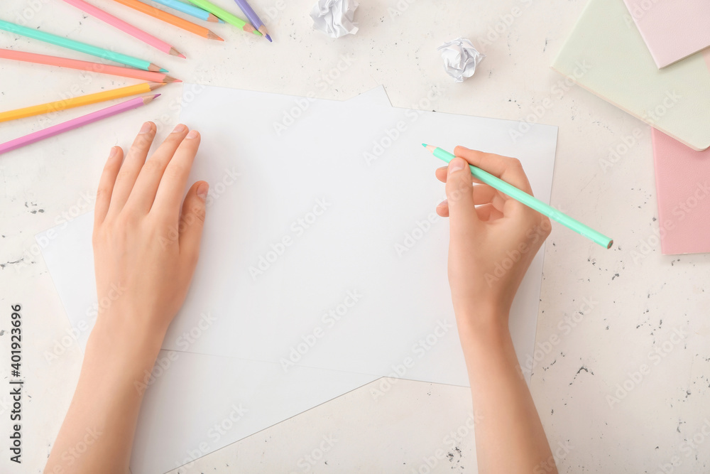 Female hands with blank paper on light background