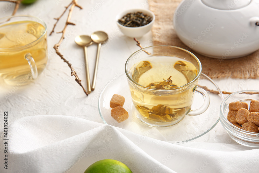 Composition with cups of green tea on table