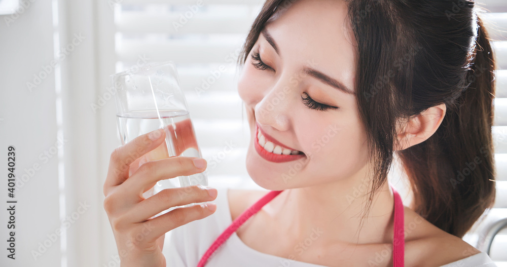 Housewife drink glass of water