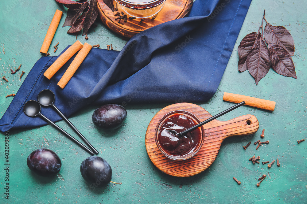 Bowl with delicious homemade plum jam on table