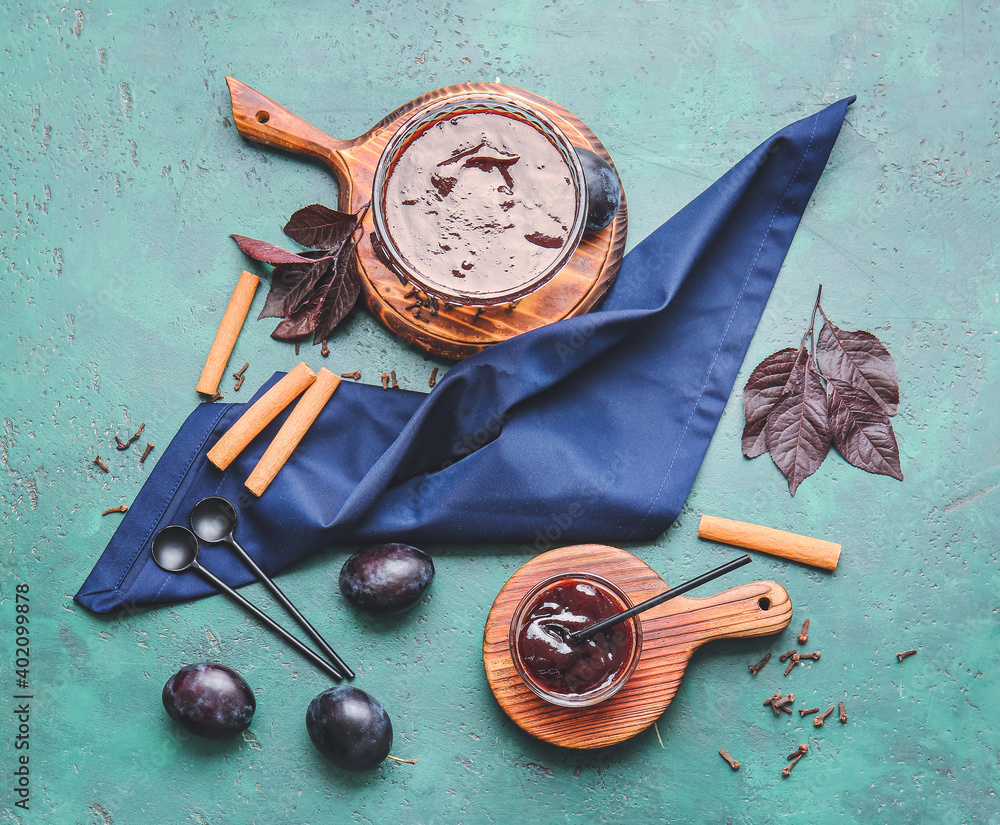 Bowls with delicious homemade plum jam on table