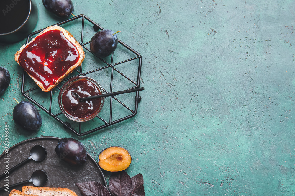 Composition with delicious homemade plum jam on table