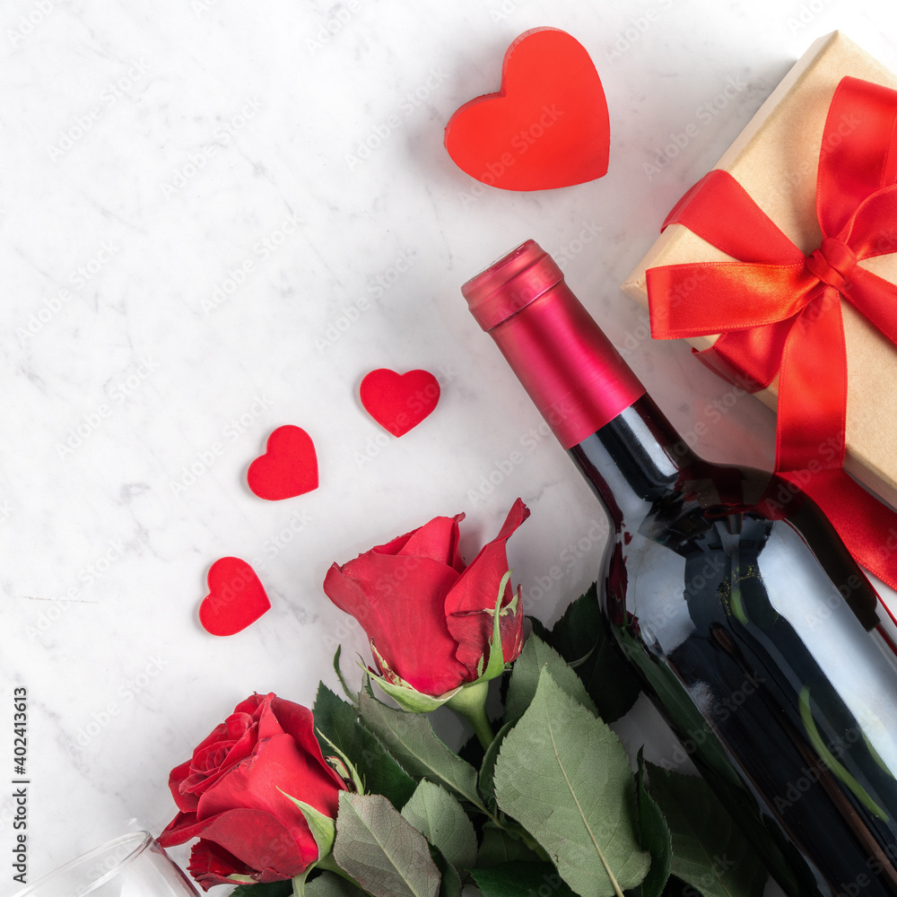 Top view of Valentine day gift with rose and wine, festive meal design concept