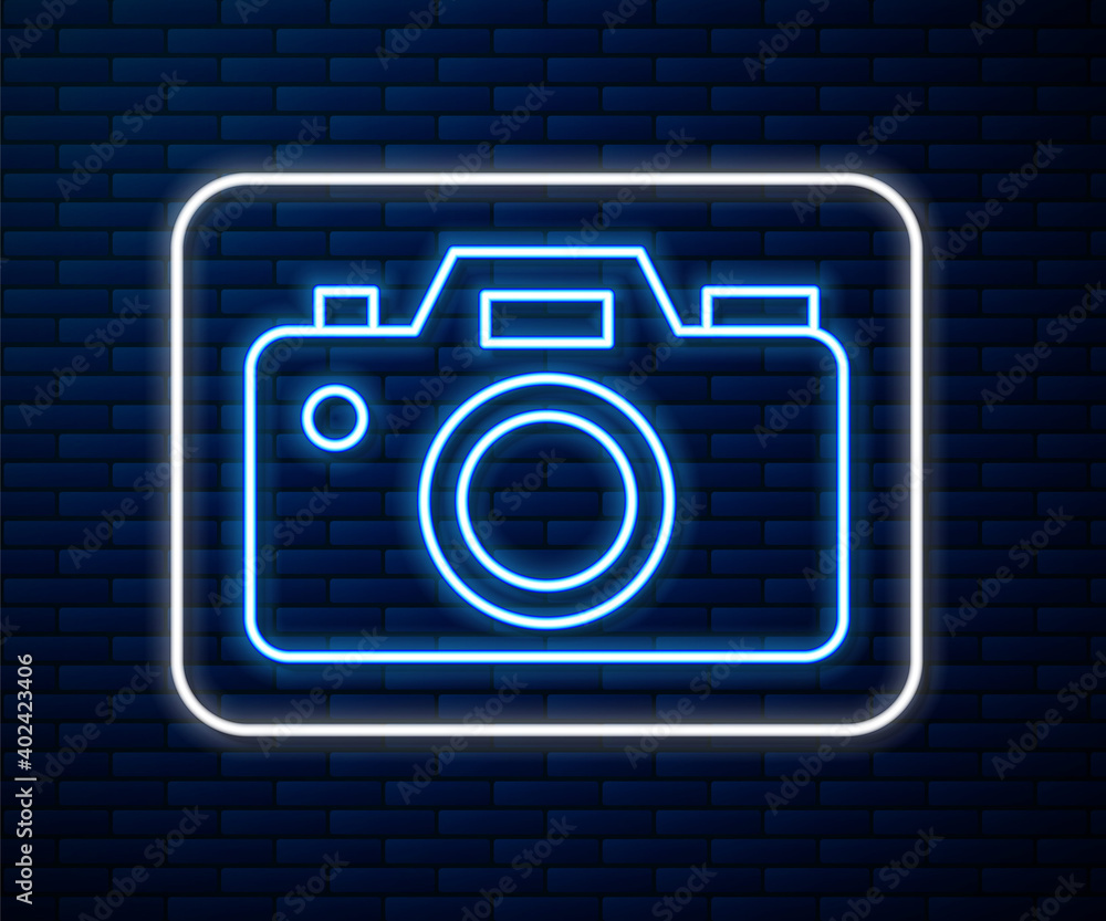 Glowing neon line Photo camera icon isolated on brick wall background. Foto camera icon. Vector.