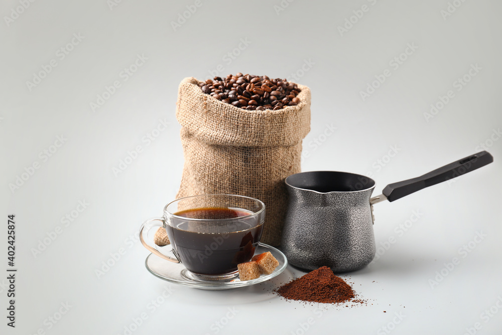 Composition with coffee bag on white background