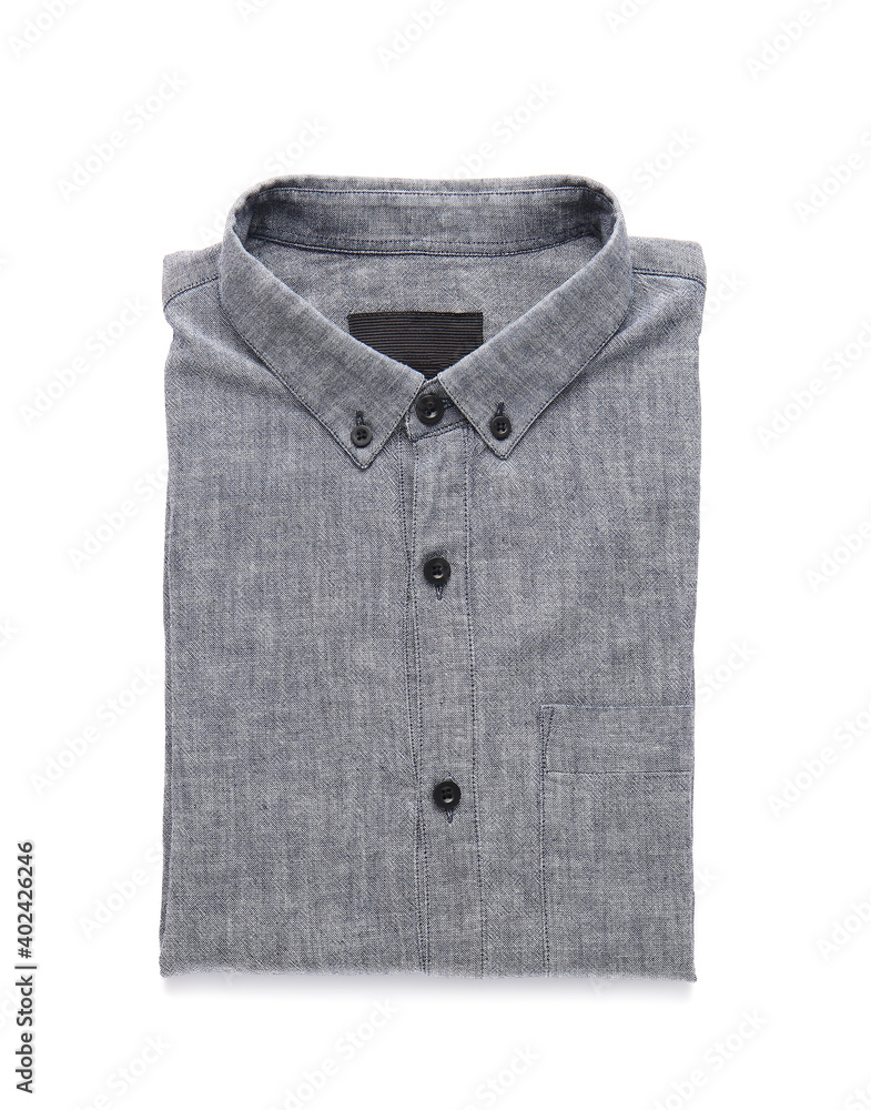 Folded male shirt on white background