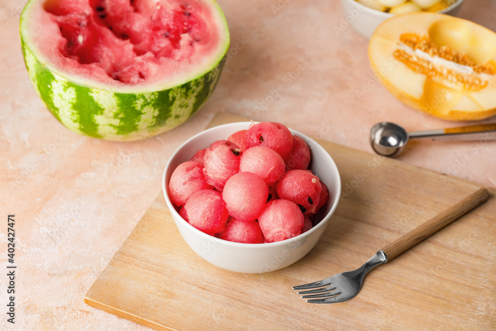 Tasty watermelon balls in bowl on table