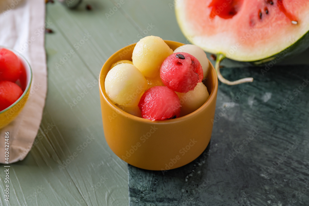 Tasty watermelon balls in bowl on table