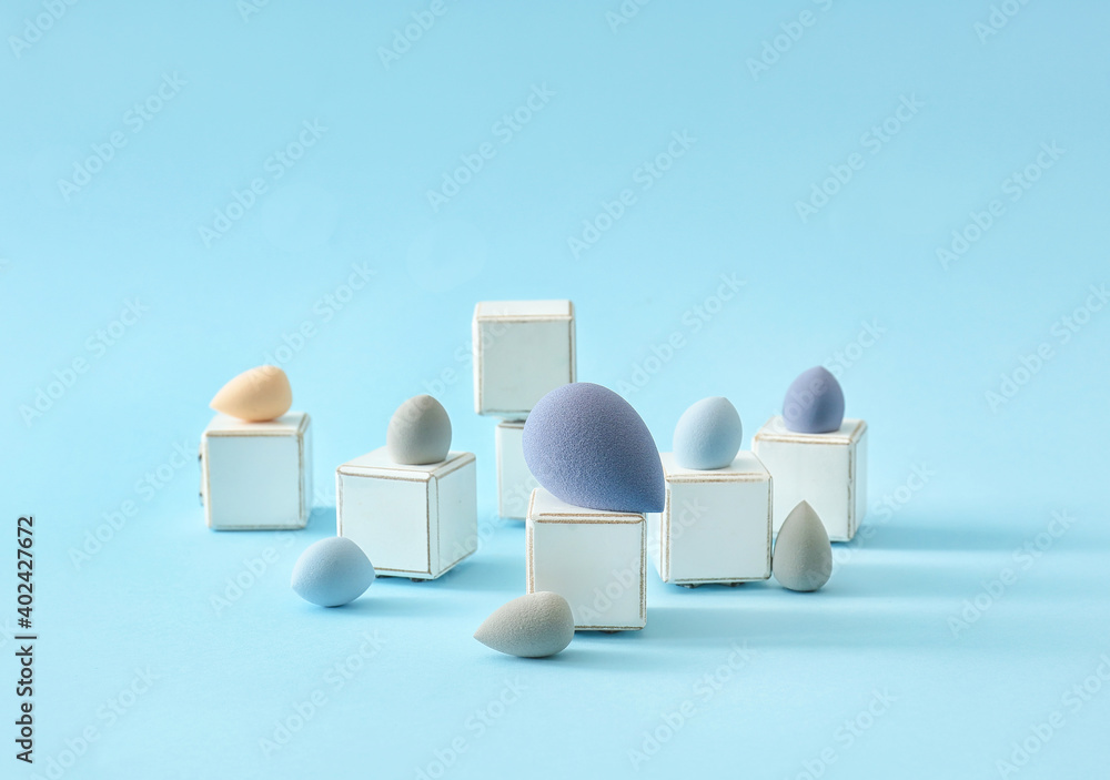 Makeup sponges on color background