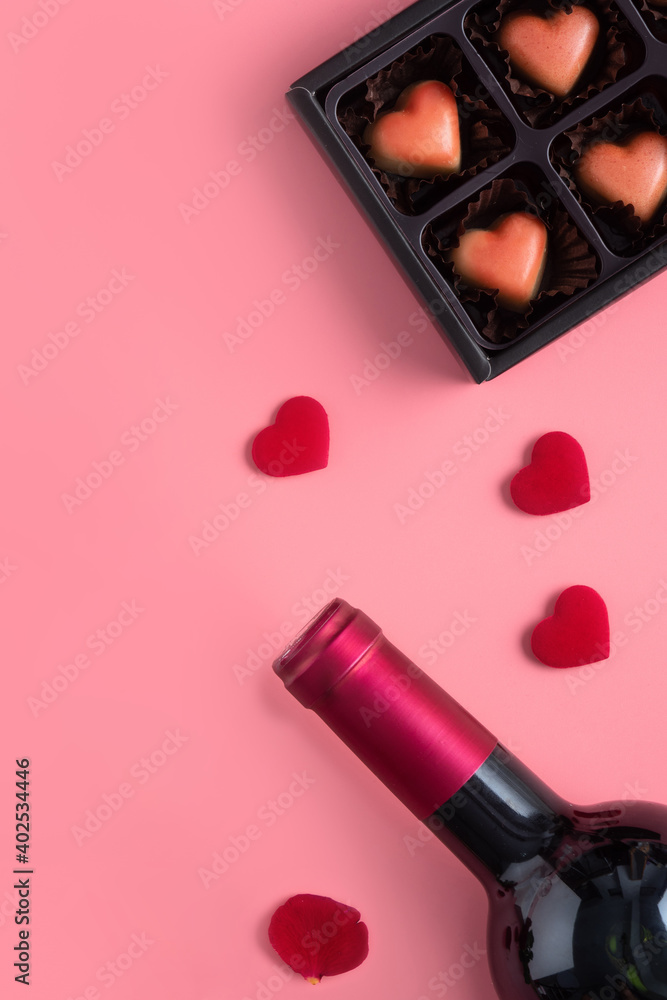 Valentines Day dating gift with wine and rose concept on pink background